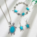 Bohemian turkoois schildpad sieradenset met ketting, armband en oorbellen op wit doek - Natuurlijk Antiek Zilver (A-361)