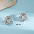 Zilveren kruisende zirkonia oorknopjes met micro-pave zetting en 15mm breedte - Stud oorbellen / Zilver