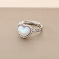 Close-up of silver ring featuring iridescent heart shell inlay and sparkling zirconia stones - Steel Color Ring Size 6