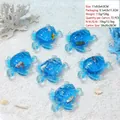 Detail of acrylic turtle liquid sand ornament with coral and shell beach decor - 191 Sea Turtle Blue Water