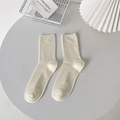 Minimalist cream white ribbed knit crew socks with vertical stripe texture in a lifestyle view - One Size / Milk White