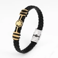 Close-up of black braided leather bracelet with golden maple leaf metal ornament and silver clasp - Maple Leaf 2