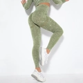 Close-up of seamless scrunch butt yoga leggings and cropped long sleeve top in green wash - Washed Army Green