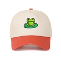 Detailed close-up of cartoon frog embroidery on a two-tone cotton trucker baseball cap - Off-White and Orange Red
