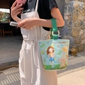 Light blue canvas tote bag featuring cute cartoon girl illustrations and green handles - Love And Power Girl