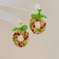Detail of handmade beaded Christmas wreath earrings with red bows and gold hooks - Christmas Wreath Gold Ball-Silver Pin / Stud Earrings
