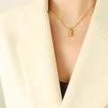Minimalist 18k gold plated stainless steel necklace with rectangular bar pendant on model - Gold (P610) / Gold Necklace