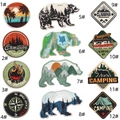 Detail view of 12 assorted colorful outdoor camping and adventure embroidered patches - Patch Collection / Set of 12