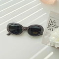 Kids oval checkerboard sunglasses with black UV400 lenses and trendy frame design - Black and White Plaid