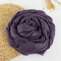 Deep purple cotton linen scarf rolled in rose shape with fringe details on white backdrop - 190x100cm / Purple