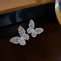 Macro detail of butterfly earrings with micro-paved rectangular cubic zirconia crystals - Silver