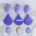 Detail view of 9-piece makeup sponge set with teardrop, triangle, and mini finger puffs - Purple 9-Piece Set