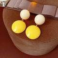 Detailed close-up of cream and yellow resin tassel earrings on a velvet jewelry box - Silver Earring Post Double Round Ball Style / Creamy White + Yellow