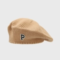 Detail of camel knit beret featuring a vintage P letter patch and soft woolen texture - Khaki