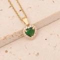 Detail of gold heart necklace with central green gemstone and micro-pave zircon setting - Green Necklace
