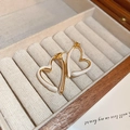 Elegant gold plated heart-shaped stud earrings with white enamel finish on a velvet box - Real Gold Plated Heart Drop / Gold + Cream