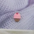 Macro detail of a resin ice cream charm with pink cream and heart for DIY jewelry making - Heart Pink Cake