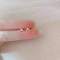 Minimalist 925 sterling silver geometric hoop stud earrings shown held by fingers - Small Circle / Silver