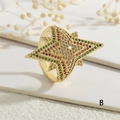 Detail van gouden sterring met kleurrijke zirkoon-inleg en elegant vakmanschap - Goud - Ster Stijl B (Gekleurde Zirkonia) / Verstelbaar Open