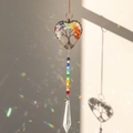 Macro shot of heart-shaped Tree of Life suncatcher casting vibrant rainbow reflections - 55 Pointed Bead Colorful Tree of Life