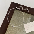 Silver chain bracelet featuring three black clover pendants on textured glass - Clover Bracelet / Silver Black