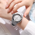 Wrist view of gray silicone strap quartz watch on girl's arm for exams and sports - Gray