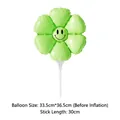 Detailed view of green flower balloon with smiley face and size specs for party decor - Handheld Daisy With Support Rod / Macaron Green