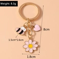 Detail view of sunflower bee keychain with dimensions and weight at 8.3g - Bee Flower Heart