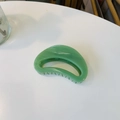 Detail view of crescent hair claw clip featuring green marble pattern and inner teeth - Approx 7cm / Leaf Green