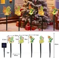 Solar Grinch themed garden stake lights with five character heads and solar panel unit - Grinch (Black Tube)