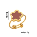 Detailed macro view of golden five-leaf clover ring with red inlay and beaded edges - Open End (711 Ring) / Red Shell