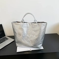 Silver metallic tote bag with TOTE BAG lettering and unique wrinkled texture detail - Silver