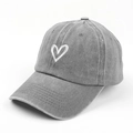 Detail of washed grey cotton baseball cap with white heart embroidery and worn texture - Adjustable / Gray