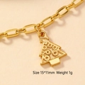Macro view of gold-plated Christmas tree charm with embossed dots, size 15x11mm and 1g - 156-Christmas Tree Shape
