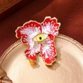 Broche fleur œil surréaliste en émail rouge et blanc avec finition métal doré - Mauvais œil / Rouge