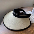 Beige wide brim sun hat with black trim and C-logo detail on a rustic wooden table - Fine Edge L-Shape Straw Hat / Beige