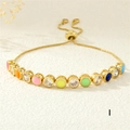 Detail of adjustable gold bracelet with colorful enamel eye charms and zircon stones - Rainbow (Style I)