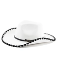 Detail of white wool cowboy hat with black stitched brim and leather band with bronze buckle - M (56-58cm) / White Hat with Black Whipstitch Edge