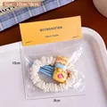 Haargummi-Set mit blauem Bären-Clip in dekorativer Geschenkverpackung - Eisbär Haargummi Kombination