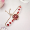 Elegant gold bracelet watch with red dial and leaf design on a soft pink background - Rose Gold Red