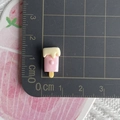 Luminous pink popsicle resin charm on scale mat showing 2cm size for jewelry making - Solid Creamy Yellow Snow Top Popsicle