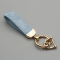 Blue suede leather car keychain with elegant gold hardware and a secure D-ring clasp - Blue/Gold