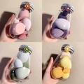Four-piece beauty sponge set in transparent bottles with floral hair rings and assorted shapes - 6-Piece Daisy Bottle Set