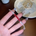 Silver plated bracelet featuring red square zircons and white crystals on female wrist - Red Square Diamond Bracelet (GA3223)