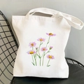 Off-white canvas tote bag with purple watercolor cosmos flowers on a black iron chair - Purple Watercolor Flowers