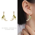 Detail of lily of the valley earrings with green leaves and pearls on model - Lily of the Valley