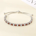 Close-up of adjustable stainless steel bracelet with red and white round cubic zirconia stones - Red and White Zirconia Style (KB207074-CALY)