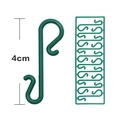 Dettaglio di ganci a S in plastica verde da 4 cm per decorazioni dell'albero di Natale - 4cm / Verde