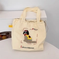 Close-up of cute dog embroidery and 1989.12.12 text on white canvas tote bag - Cool Dog