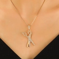 Gold scissors and comb pendant necklace with clear crystals on a sleek snake chain - Gold Necklace (11391)